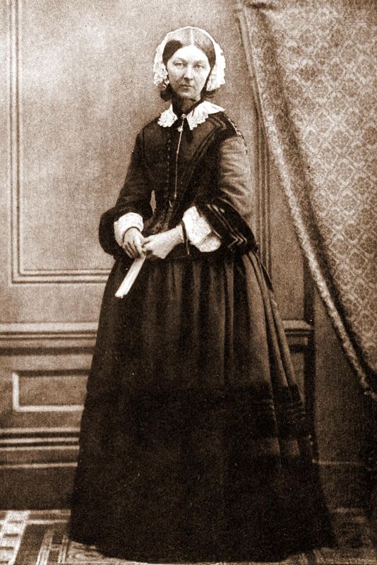 Black and white photograph of Florence Nightingale seated, wearing a dark dress and white cap